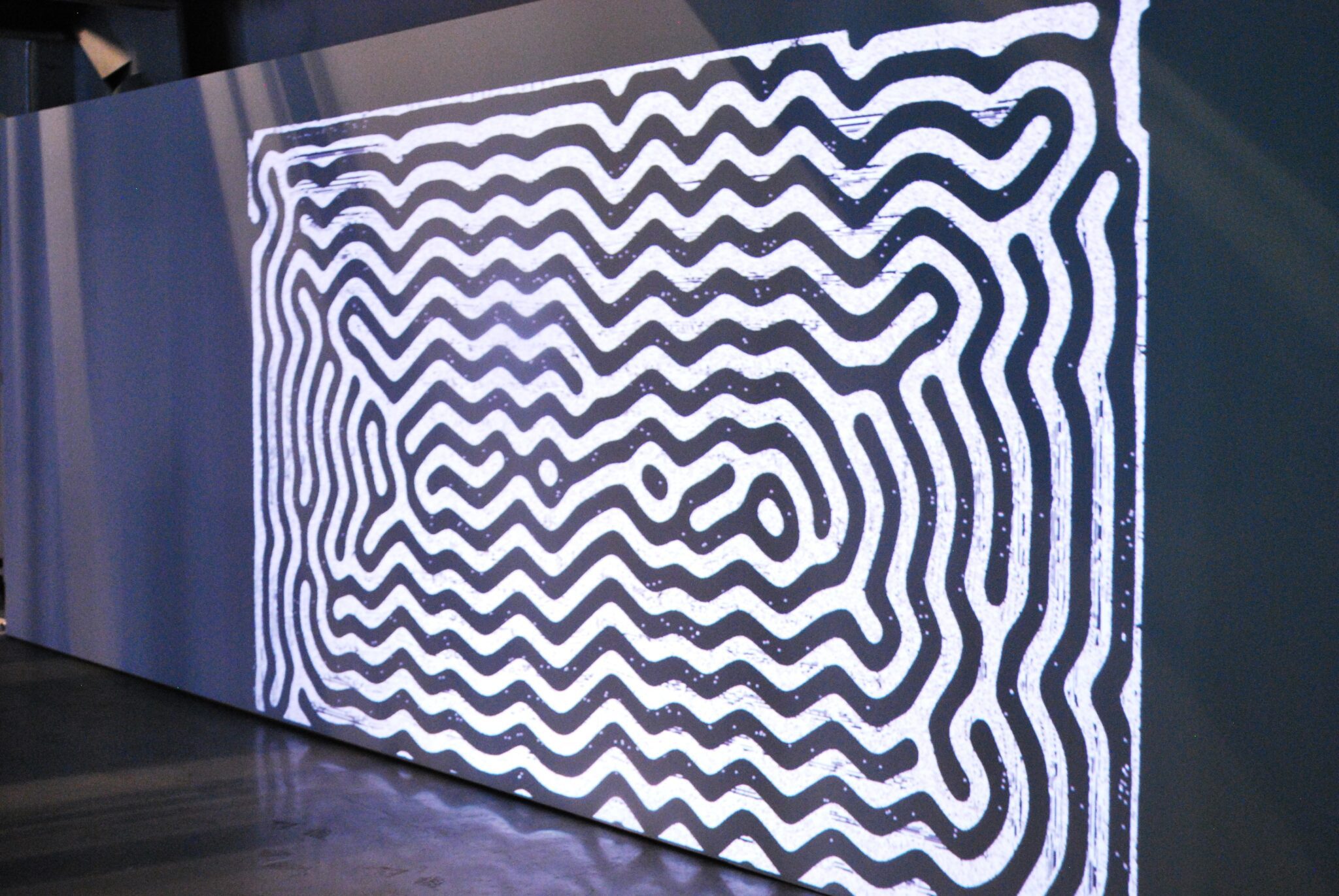 video projection of black and white zig zag lines
