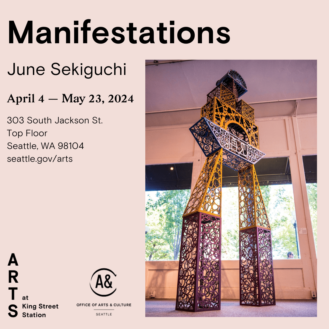 Large sculpture of building blocks making a large arch. Manifestations by June Sekiguchi.
