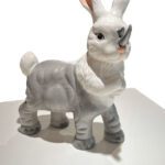 Ceramic chimera that's half fluffy bunny, half rhinoceros.