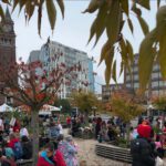 A crowd on Indigenous Peoples' Day on the King Street Station Plaza