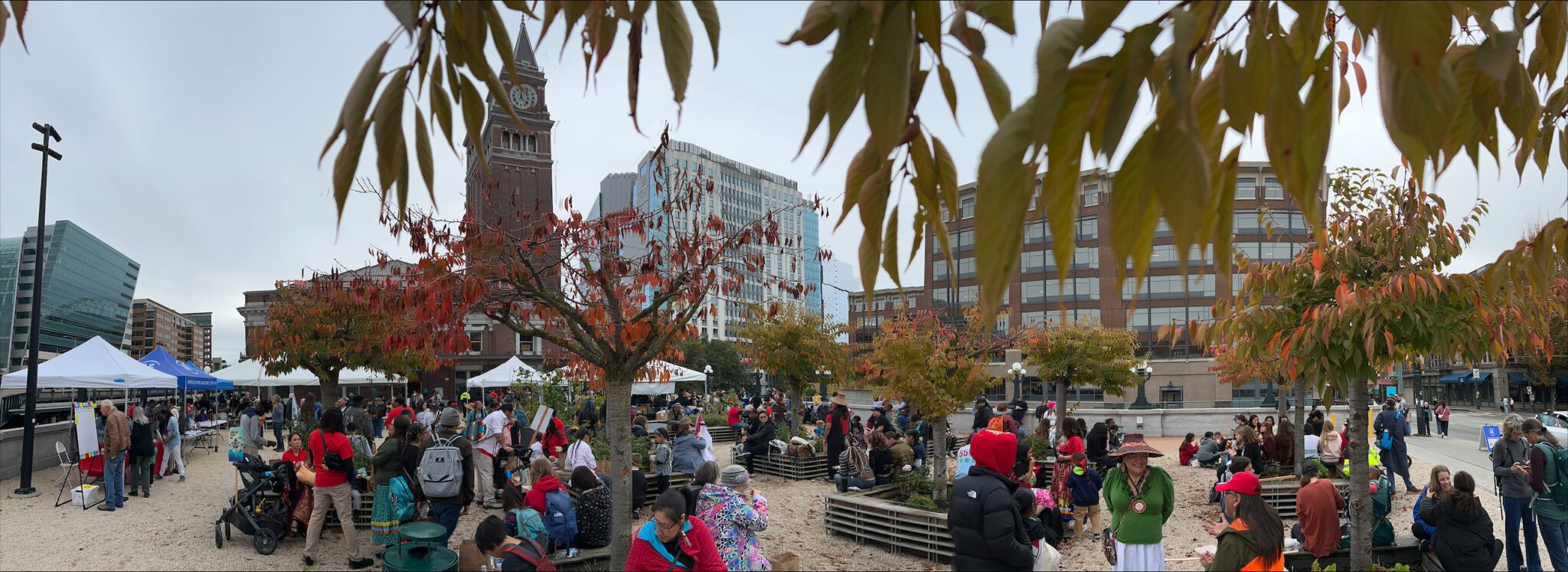 A crowd on Indigenous Peoples' Day on the King Street Station Plaza