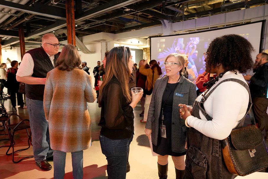 People mingle in the gallery