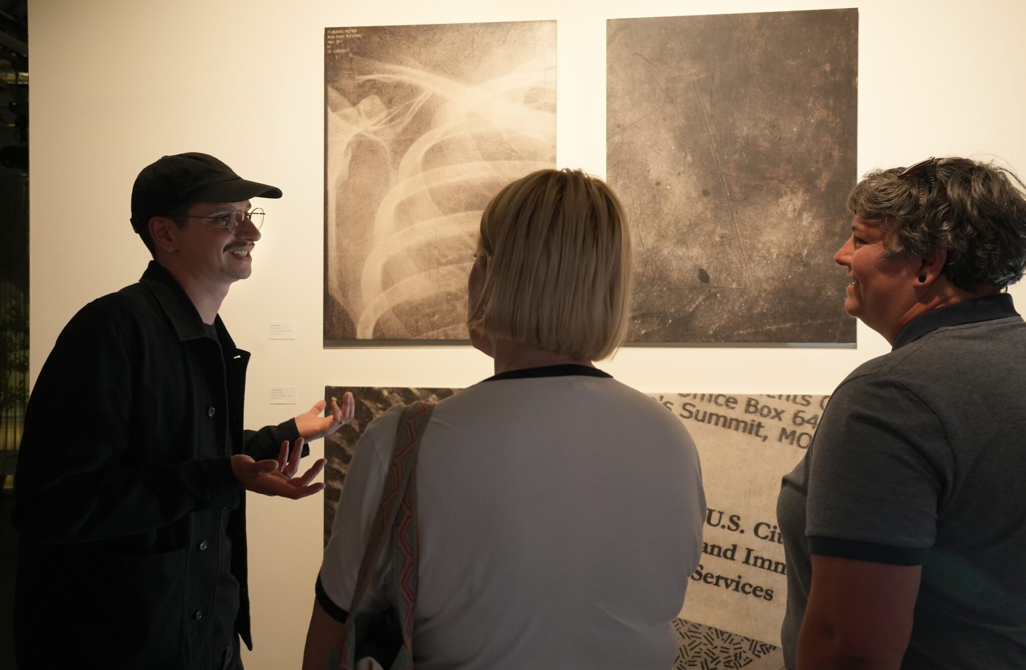 Artist Pete Fleming stands next to work in "Eight Years of Inscape AiR"