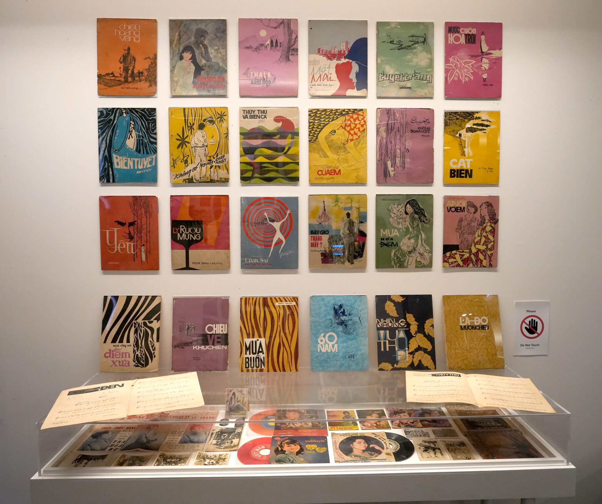 Vinyl record covers line the wall in Artist Thanh Tan's "South Vietnam’s Golden Music Archive" listening room.