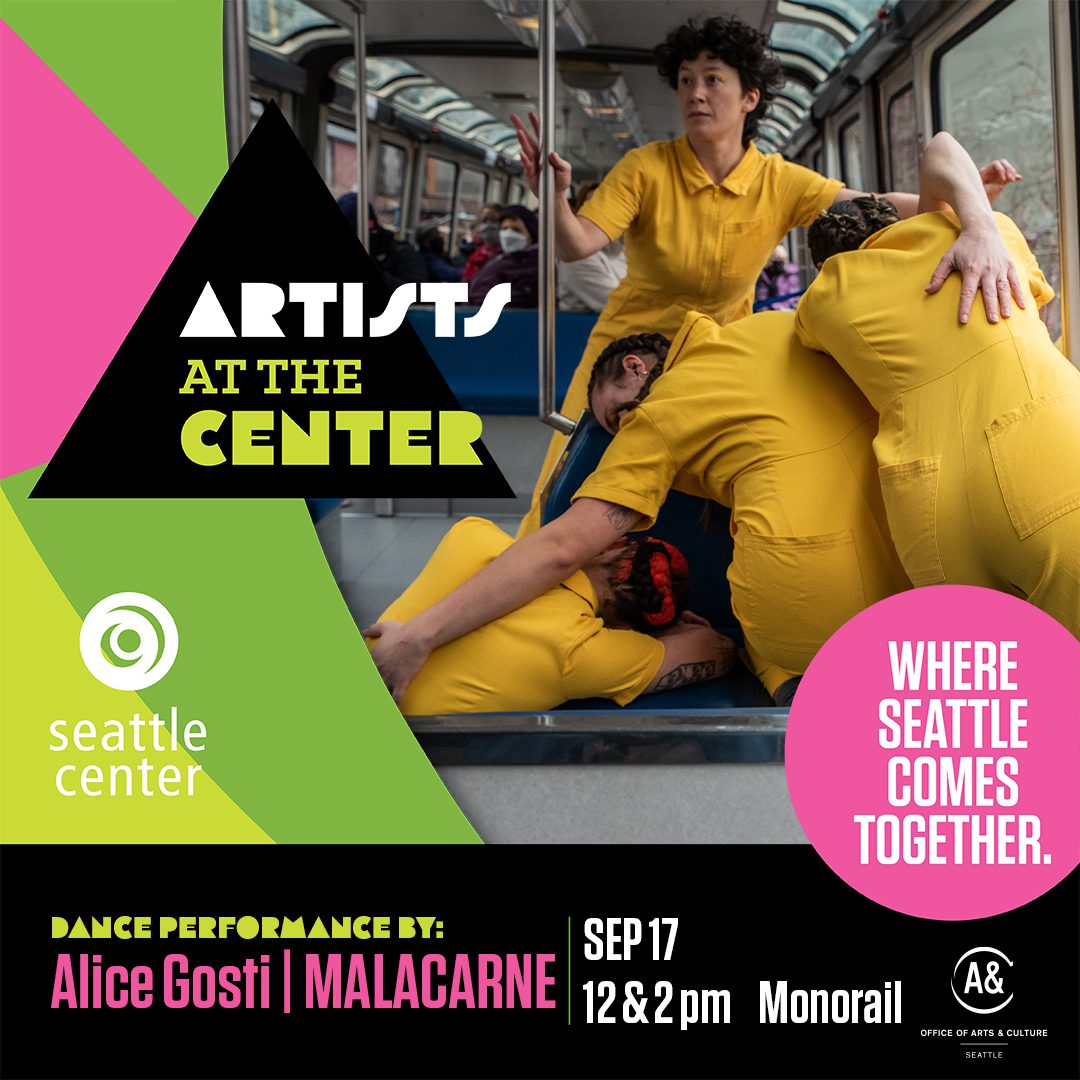 Dancers in matching yellow jumpsuits move and embrace each other on board the Seattle Monorail.