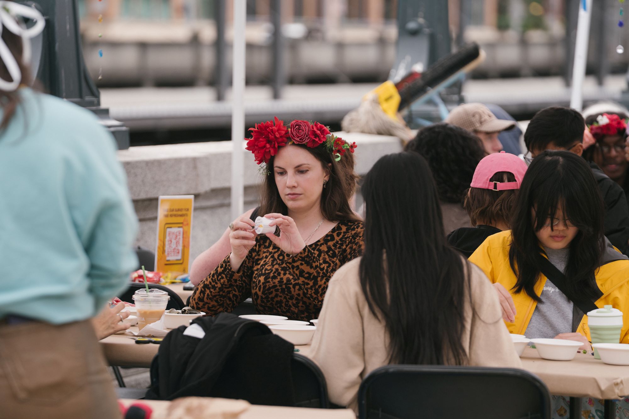 A table of people making crafts