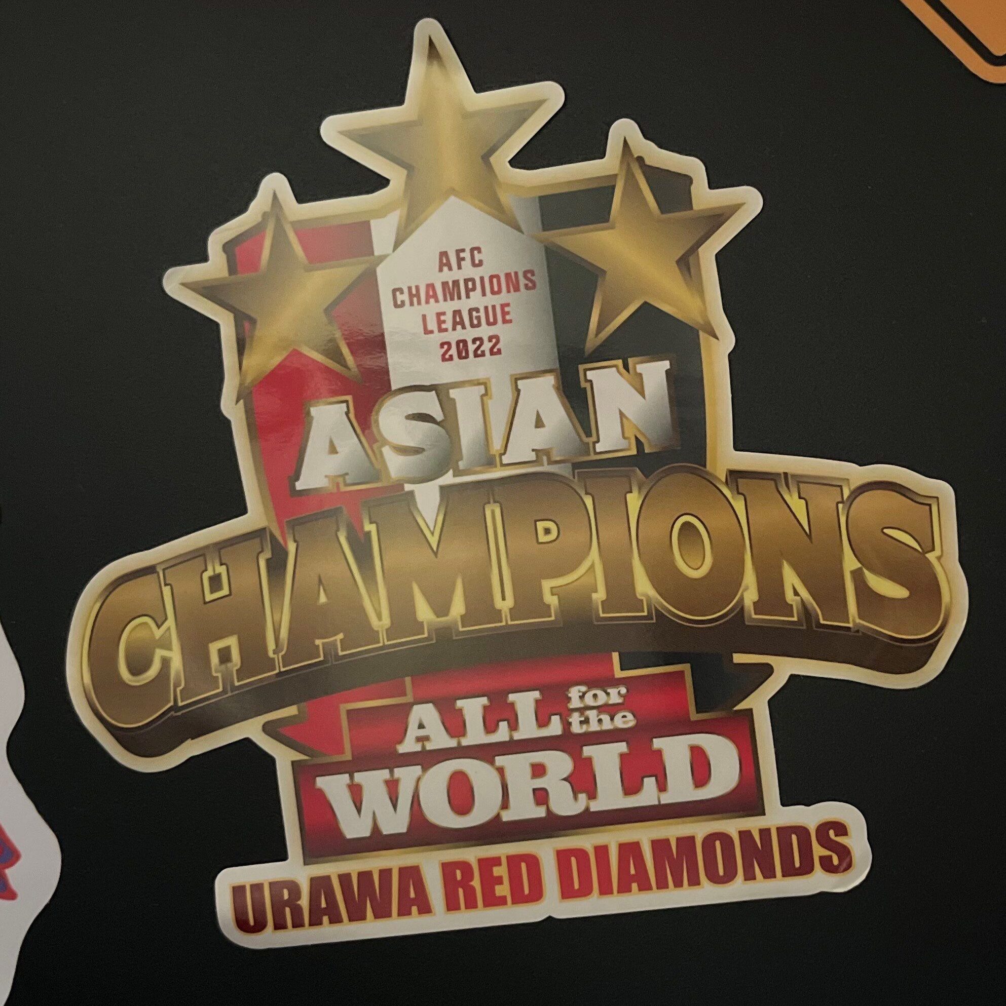 Sticker that reads "AFC Champions League 2022, Asian Champions, All for the world Urawa Red Diamonds."