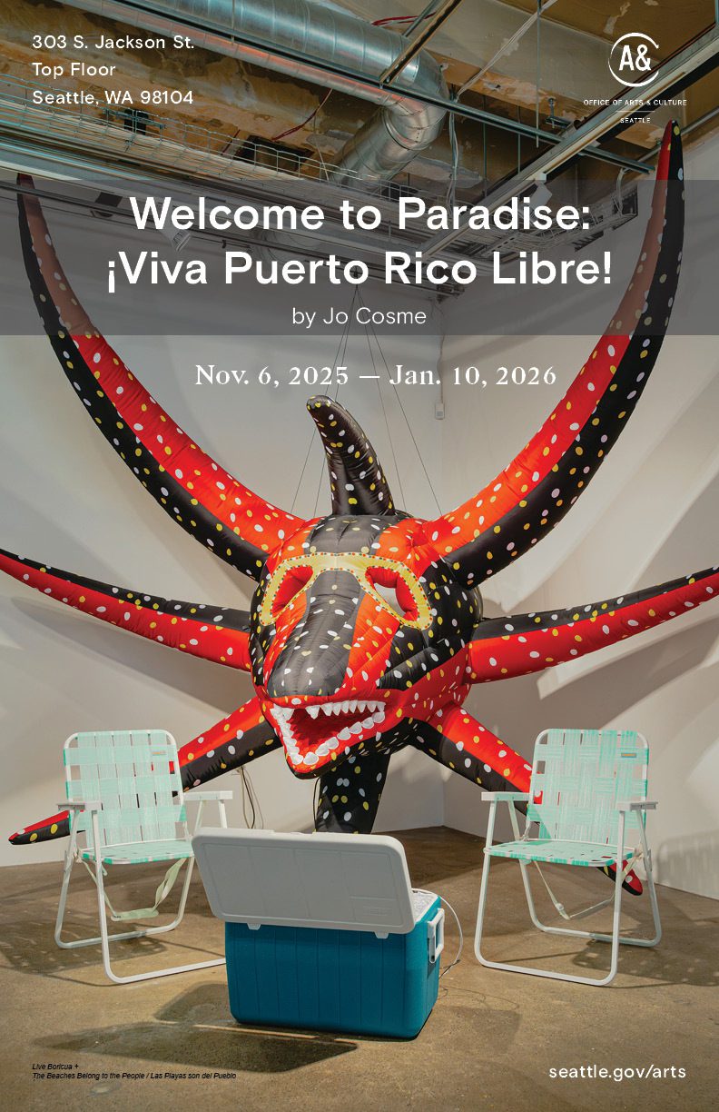 A large inflatable vejigante hangs from the ceiling. It's flanked by two beach chairs and a cooler with the lid open.
